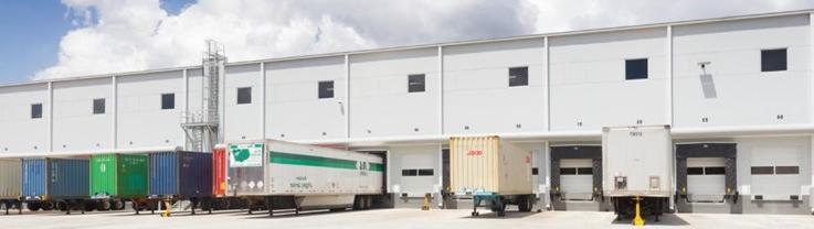 Truck trailers parked in front of a warehouse